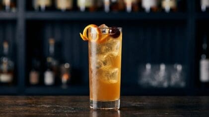 Basic But Good Punch cocktail in tall highball glass with ice